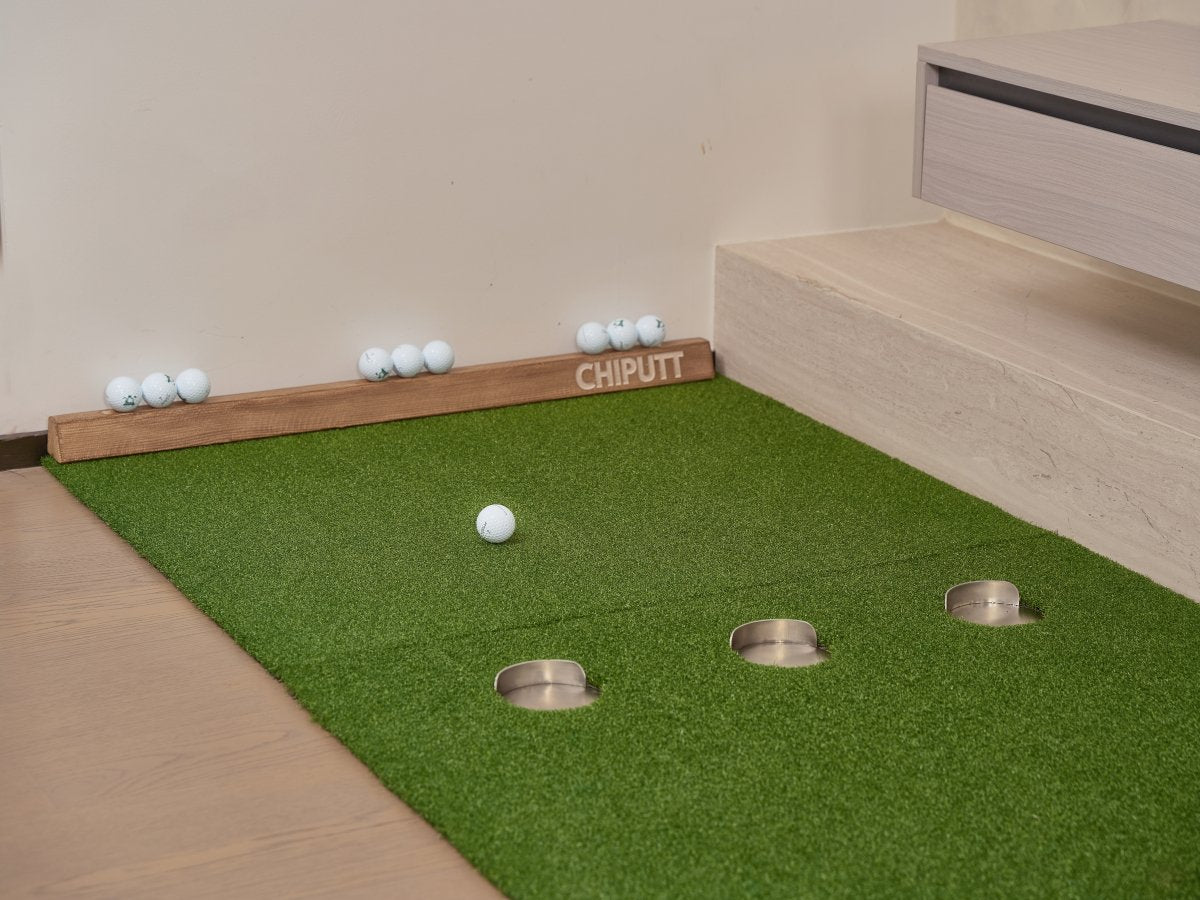 Chiputt chipping mat placed behind putting mat showing golf ball stopped within 3-foot rule for successful distance control