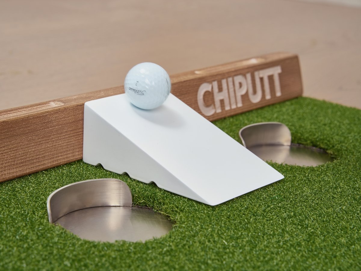 Chiputt putting mat PaceMaster showing ideal 3-feet-past-hole firm putt with Chiputt-branded Titleist Pro V1 ball