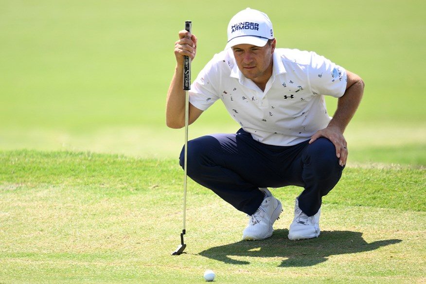 Jordan Spieth reads a putt with his TP Mills blade putter during a 2026 PGA Tour round