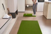 Golfer practicing chip shot on Chiputt’s complimentary step-on mat in living room, using a soft foam golf ball chipped in mid-air.